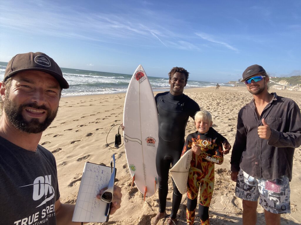happy surfers at the beach