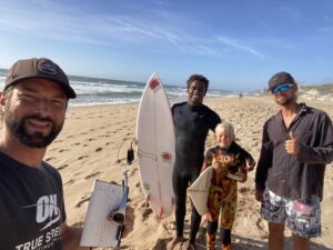 happy surfers at the beach